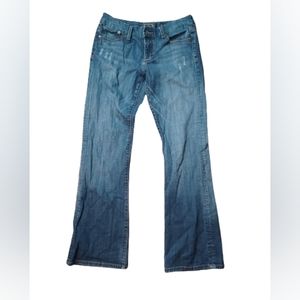 Seven boot cut distressed jeans.